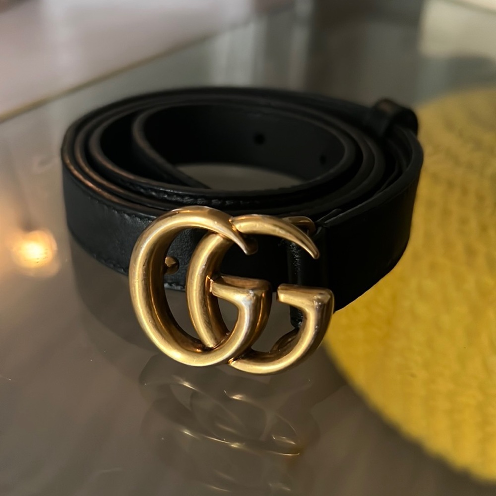 Black and gold Gucci belt